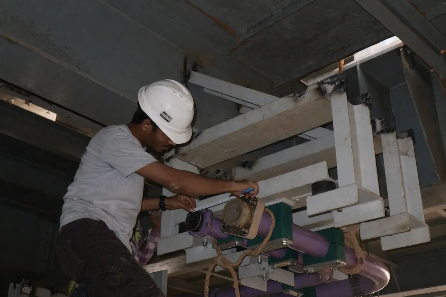 Cenergy Offshore QC Inspector Inspecting Pipes