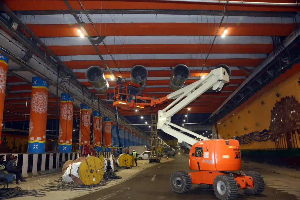 Cenergy Offshore Technician Crimping Pyplok® for Water Mist System on Cherry Picker in Dwarka Tunnel.