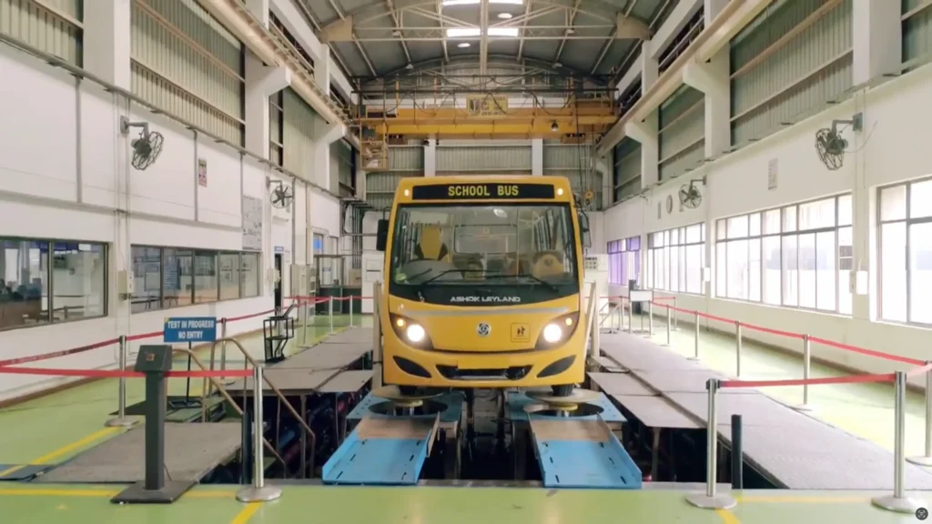 school van undergoing road simulation with help of tube mac non-welded piping at ashok leyland technical centre